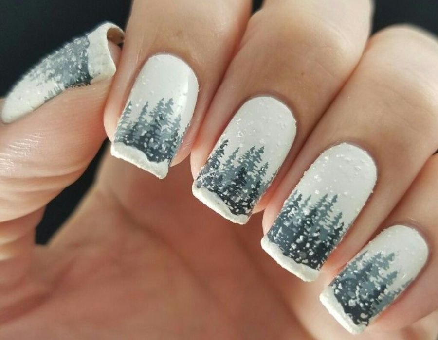 Christmas trees amidst a snowy background